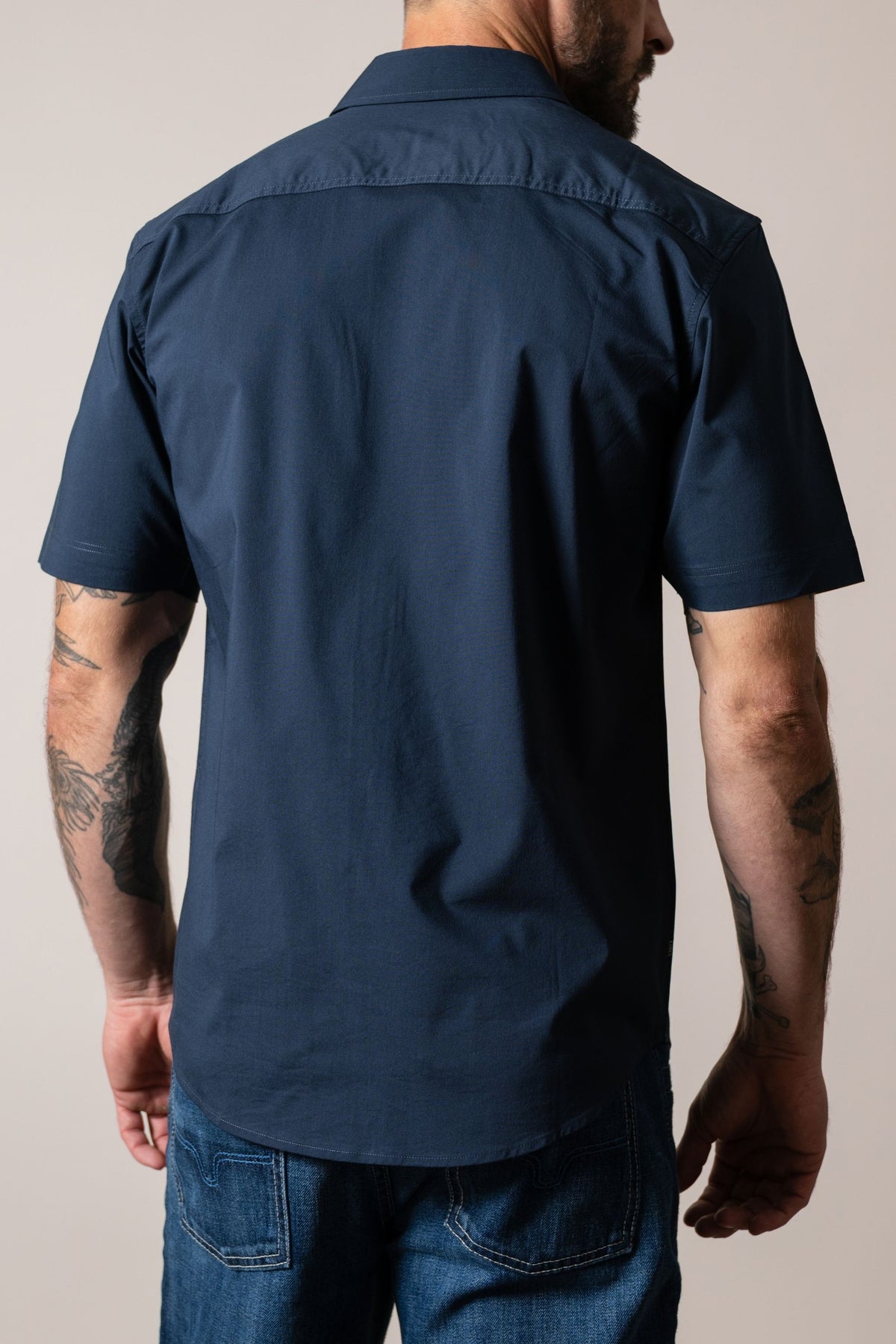 Kimes Ranch Linville Short Sleeve Dress Shirt in Navy, back view, with a back yoke and short sleeves
