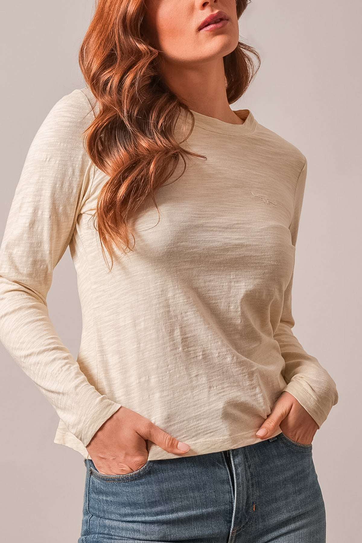 Kimes Ranch Ainsley long sleeve crew neck top in natural with logo at left chest