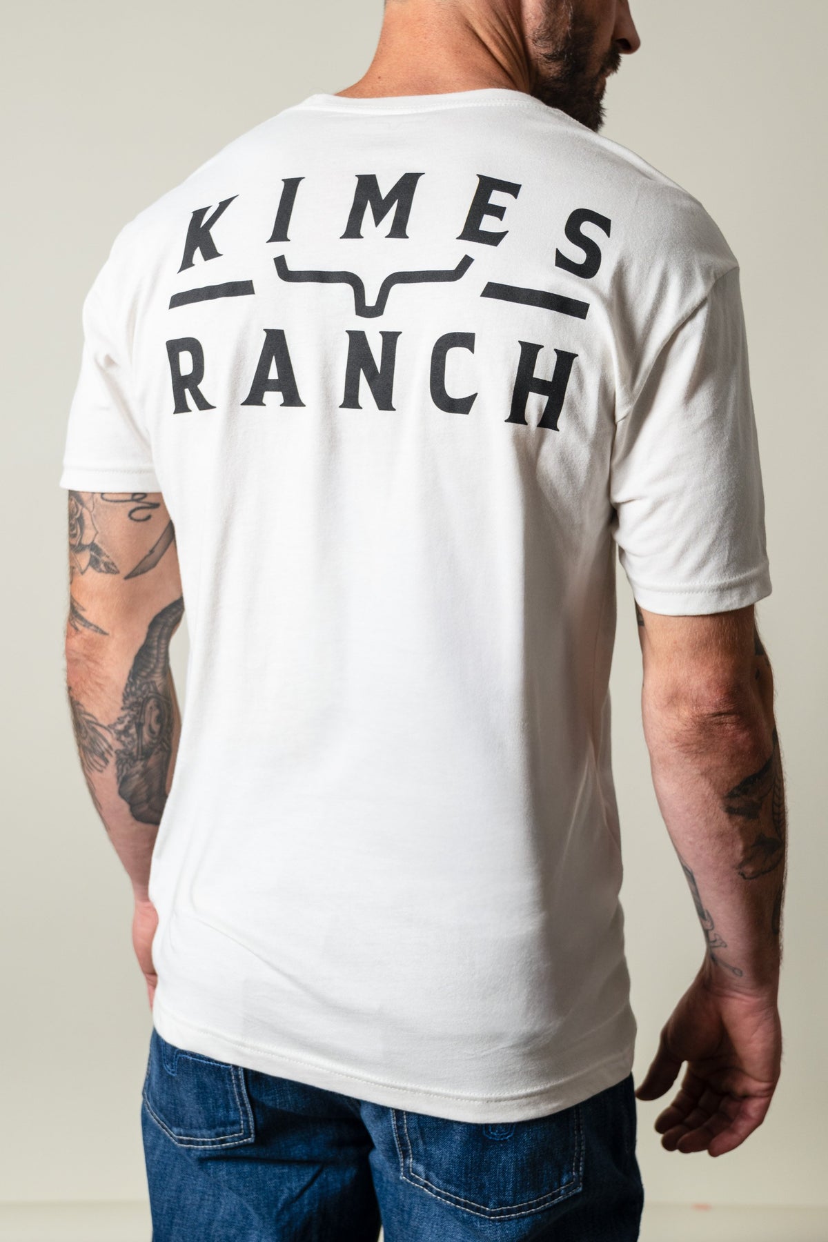 Kimes Ranch Back Branded short sleeve shirt in Bone with black KIMES RANCH logo and steer mark on back; #color_bone