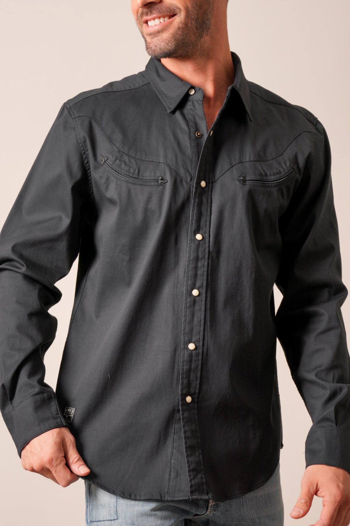 Kimes Ranch Baffert black long sleeve button down shirt with pointed collar and arrow stitching on chest pockets