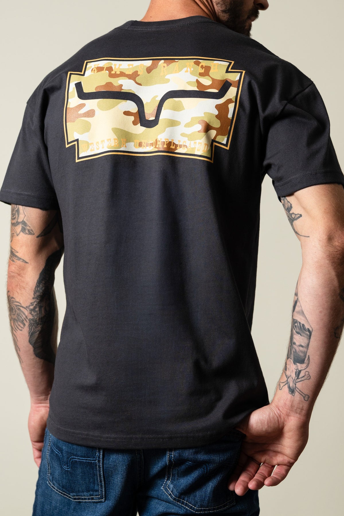 Kimes Ranch Camo Crest graphite black short-sleeve tee with camo crest graphic on back; #color_graphite black