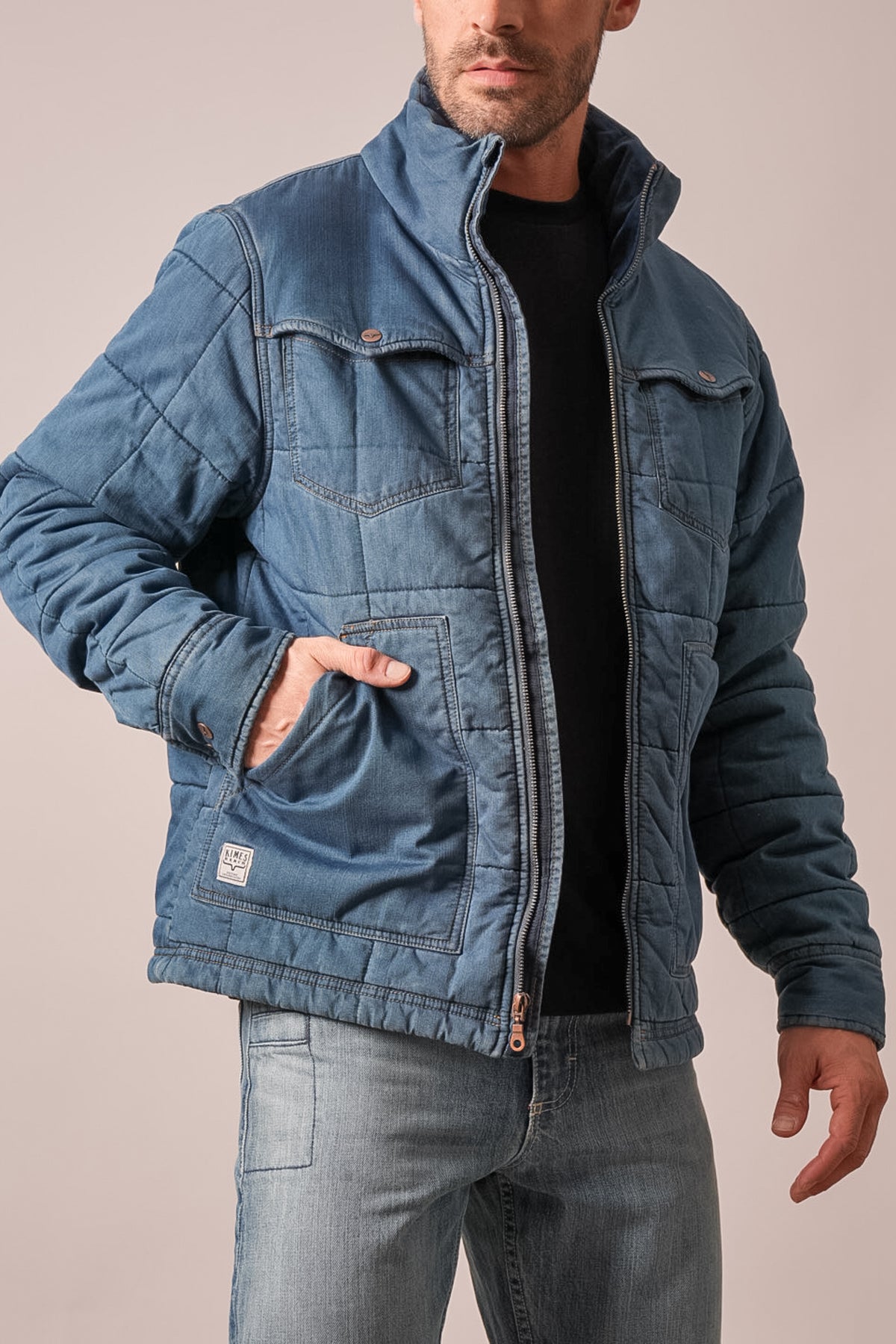 Kimes Ranch Colt jacket in indigo with stand collar, zip closure, quilted panels, button flap pockets and Kimes Ranch logo