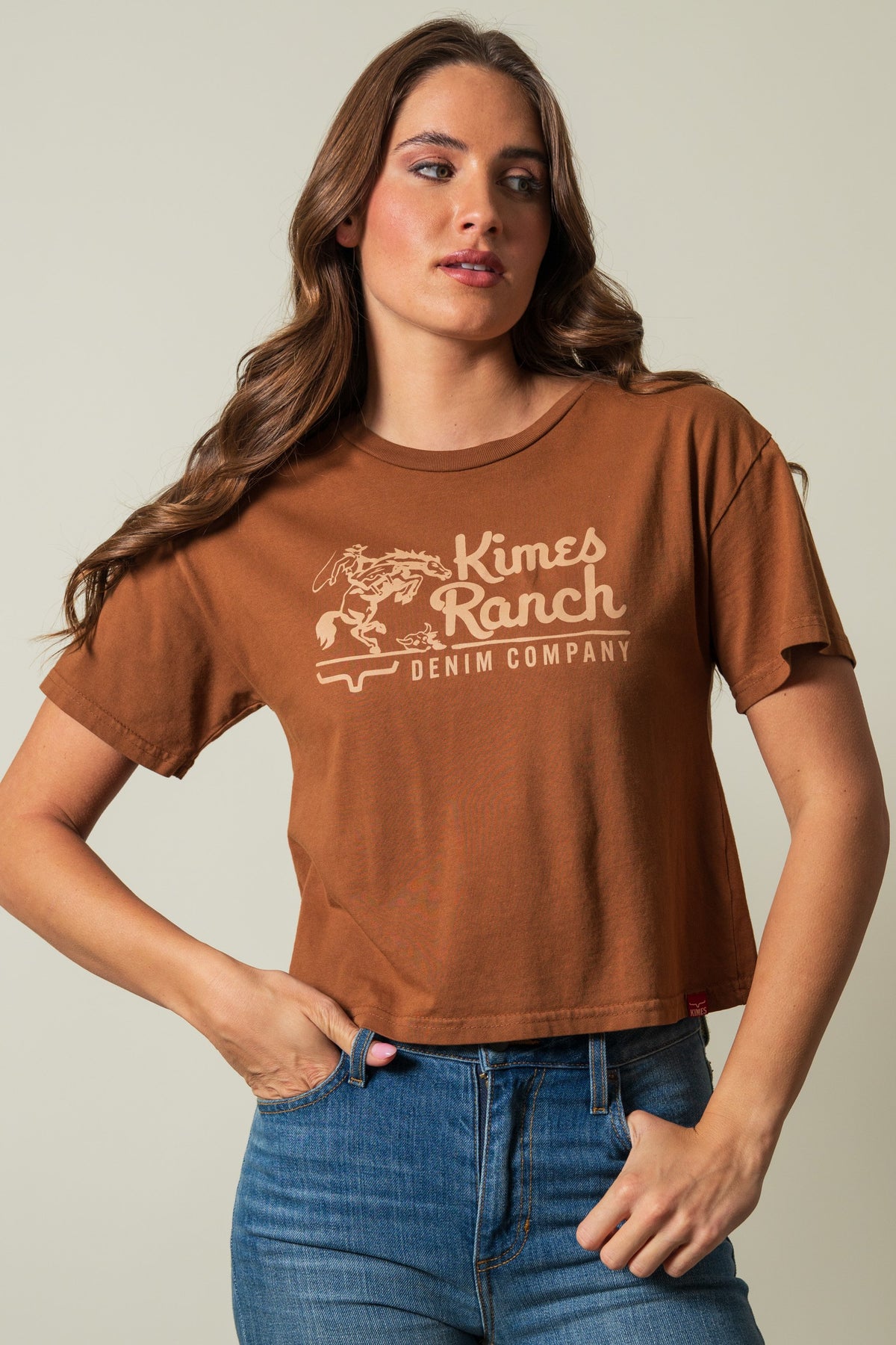 Kimes Ranch Davona Dale brown short sleeve crewneck tee with graphic print, "Kimes Ranch" and "DENIM COMPANY" in cream; #color_brown