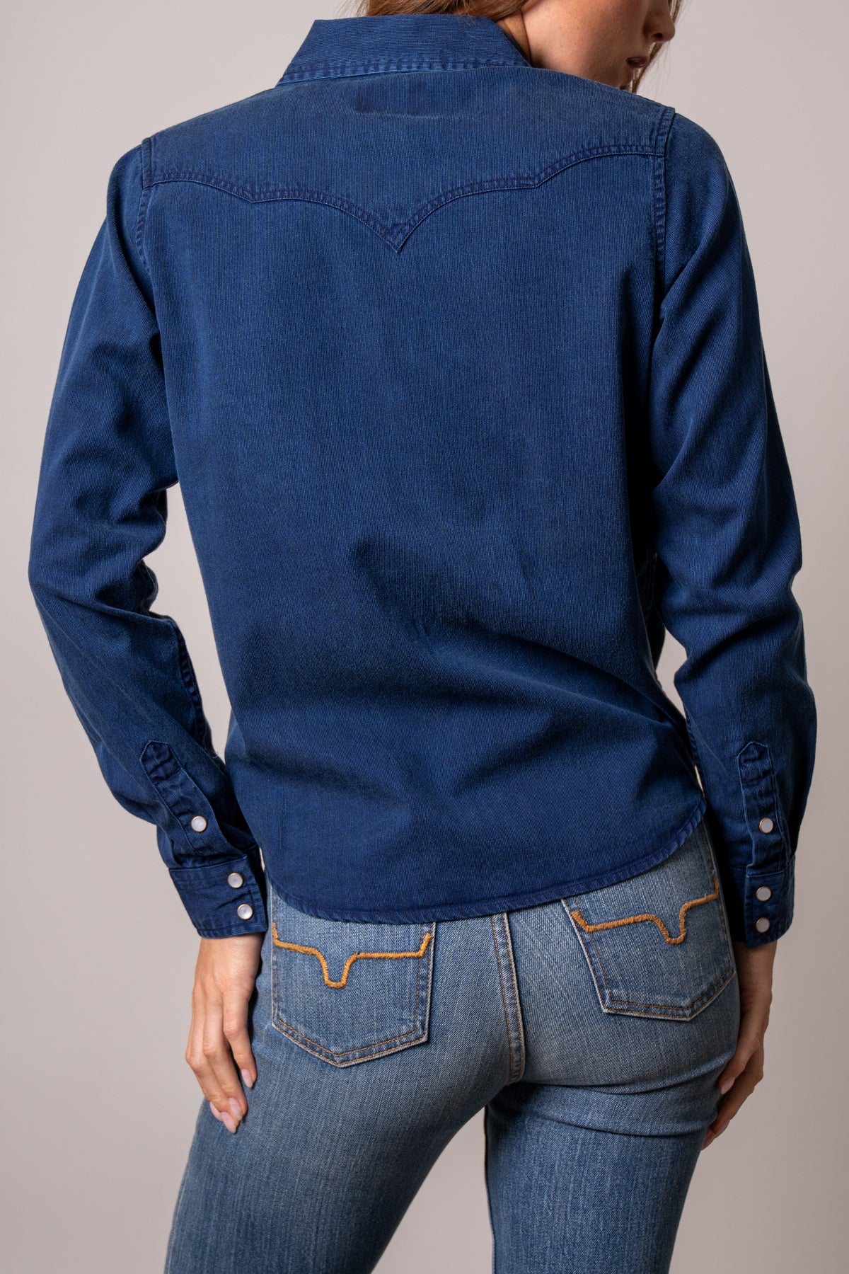 Kimes Ranch Della dark indigo denim shirt back view with western yoke and snap cuffs