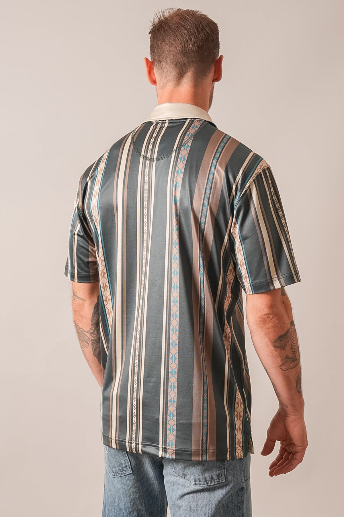 Kimes Ranch Evans polo shirt back view in Forest with vertical stripes in teal, beige, brown with patterned accents