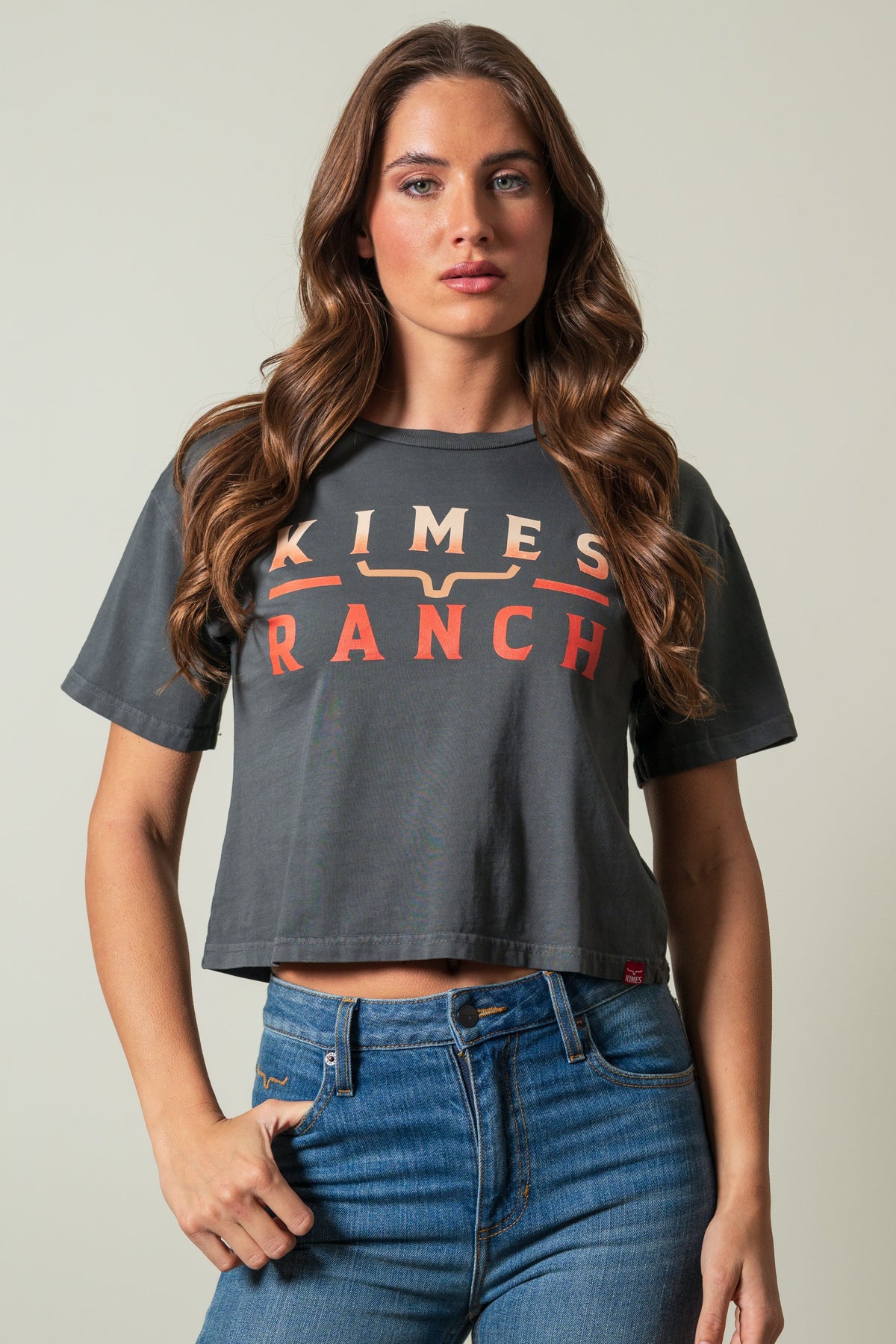 Kimes Ranch Faded Brand short sleeve crewneck shirt in pepper with KIMES RANCH text graphic in cream and orange; #color_pepper