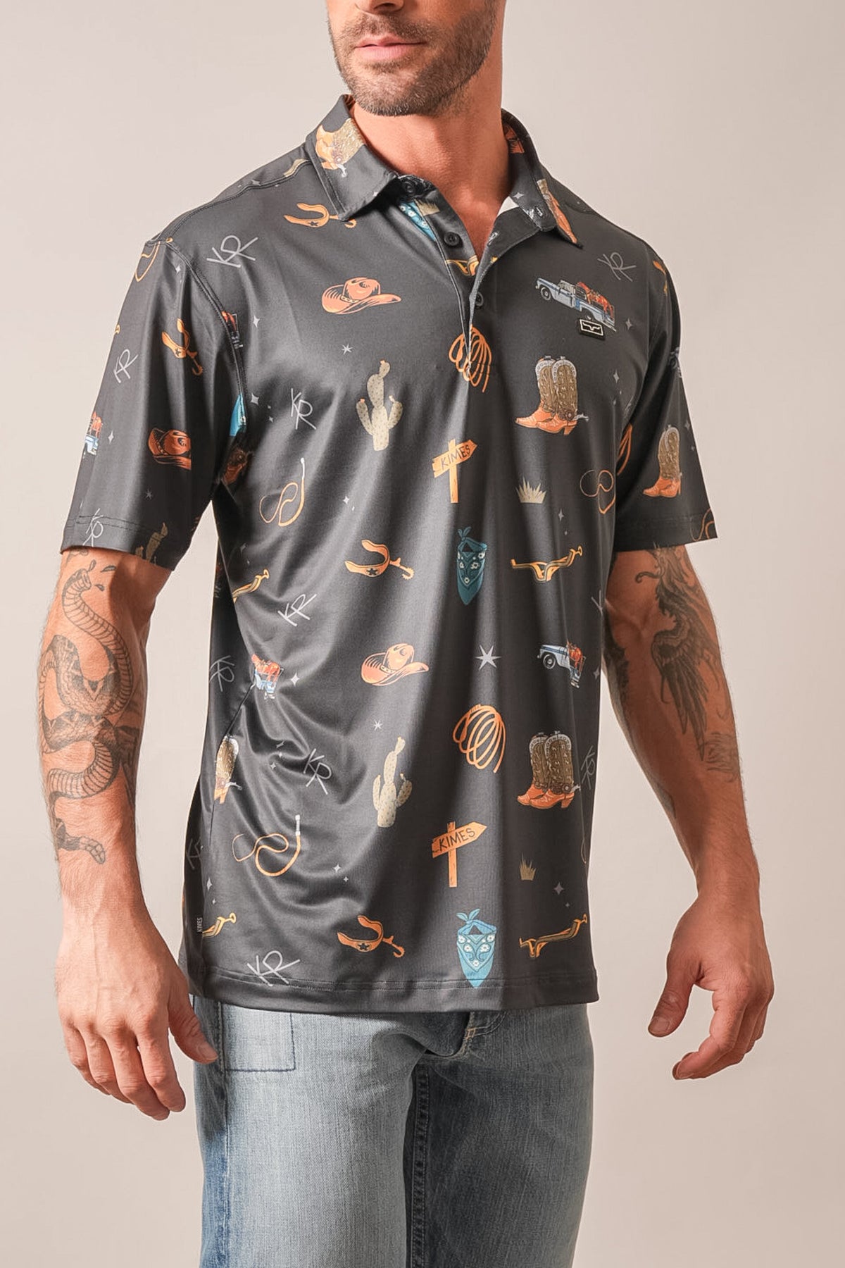 Kimes Ranch Hickman black polo with repeating western motifs of cacti, cowboy boots, and lassos