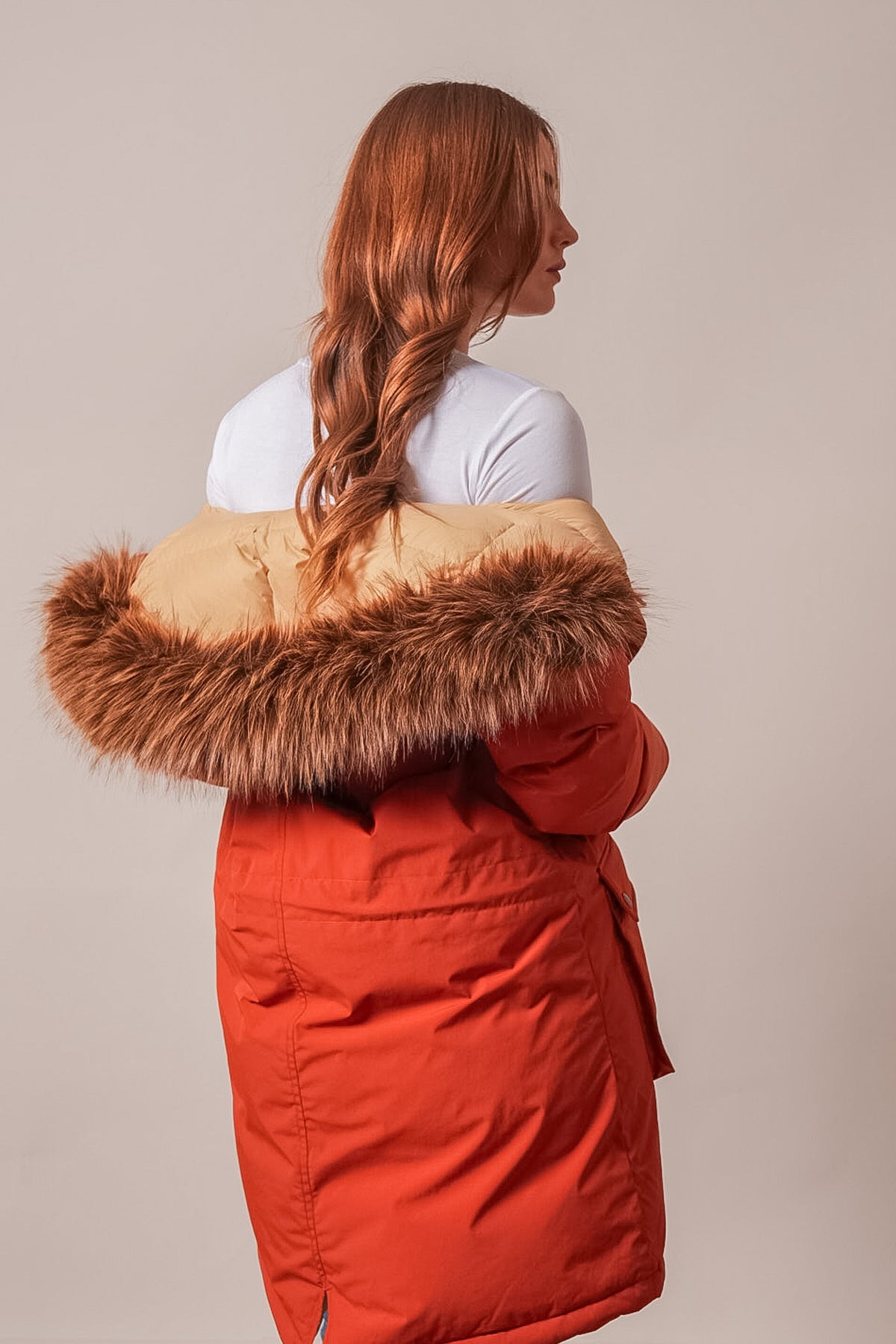 Kimes Ranch Montana Jacket in Burnt Red with tan hood and brown faux fur trim