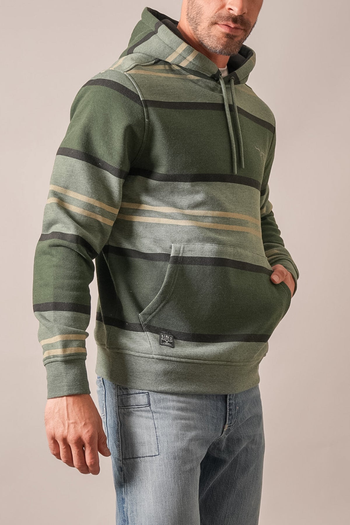 Kimes Ranch Owen hoodie in Forest colour with horizontal black and tan stripes, kangaroo pocket, and logo patch