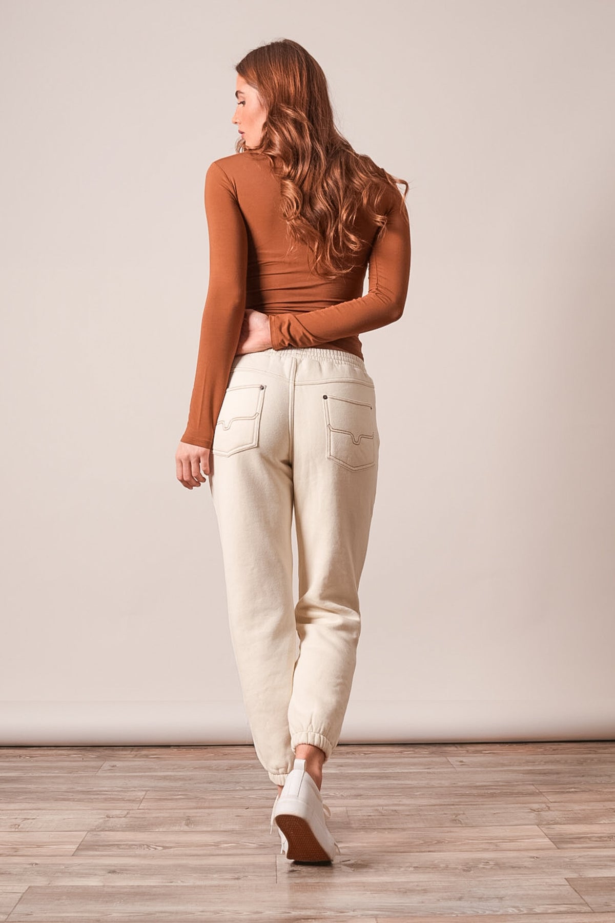 Kimes Ranch Page pants in Natural, back view featuring a drawstring waist, two back pockets, and tapered jogger cuffs