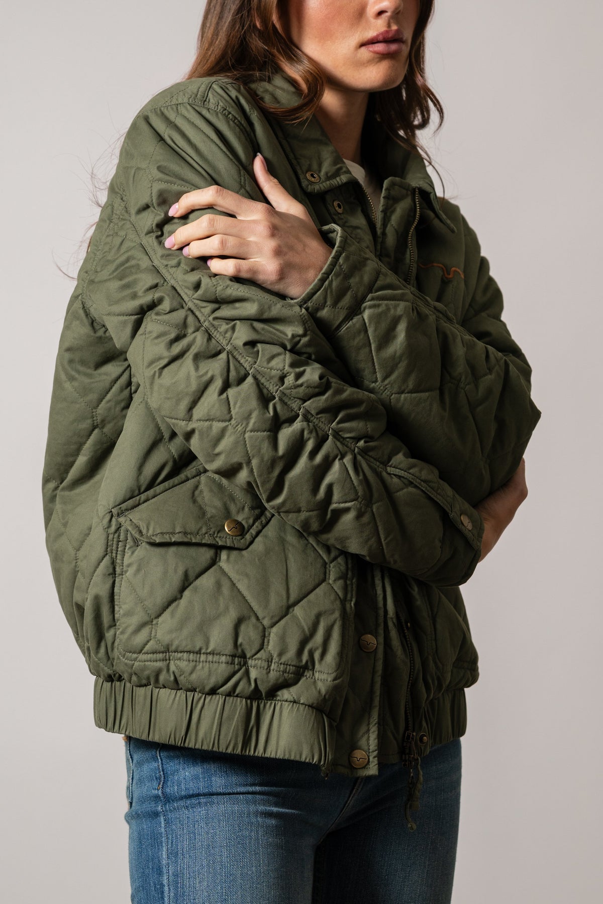 Kimes Ranch Phoeby jacket in moss with diamond quilting, buttoned pockets, stand collar, and elastic hem