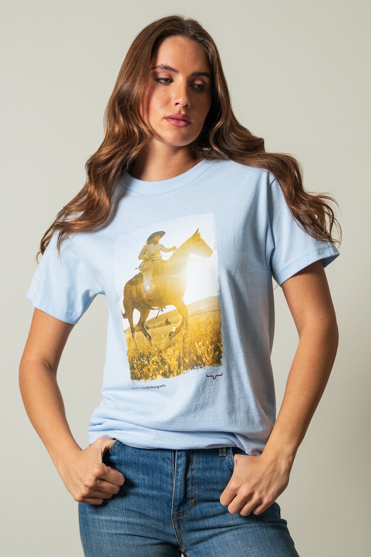 Kimes Ranch SS Riding Sunshine powder blue short sleeve shirt with a graphic print of a rider on a horse in a sunny field; #color_powder blue
