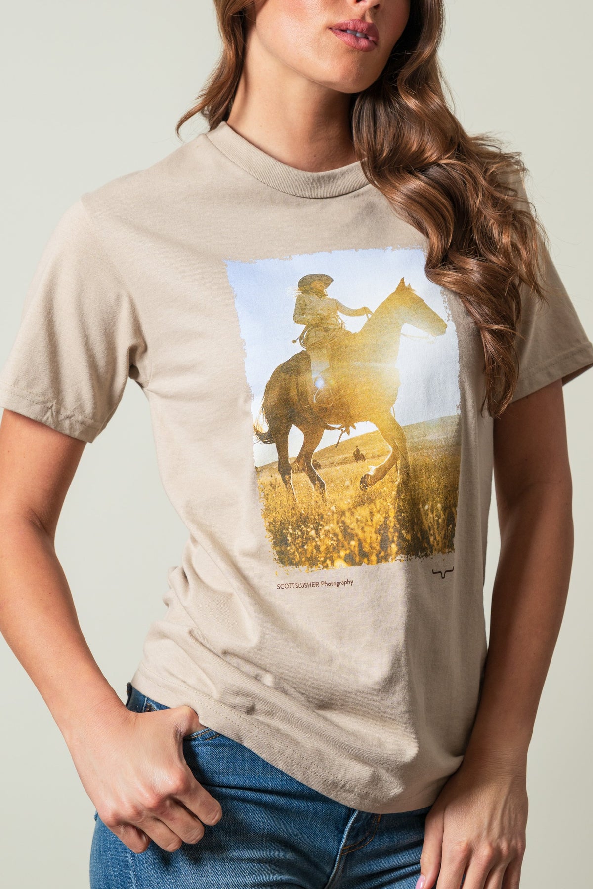 Kimes Ranch SS Riding Sunshine shirt in Sand with a rider on a horse, Scott Slusher Photography text, Kimes Ranch logo; #color_sand