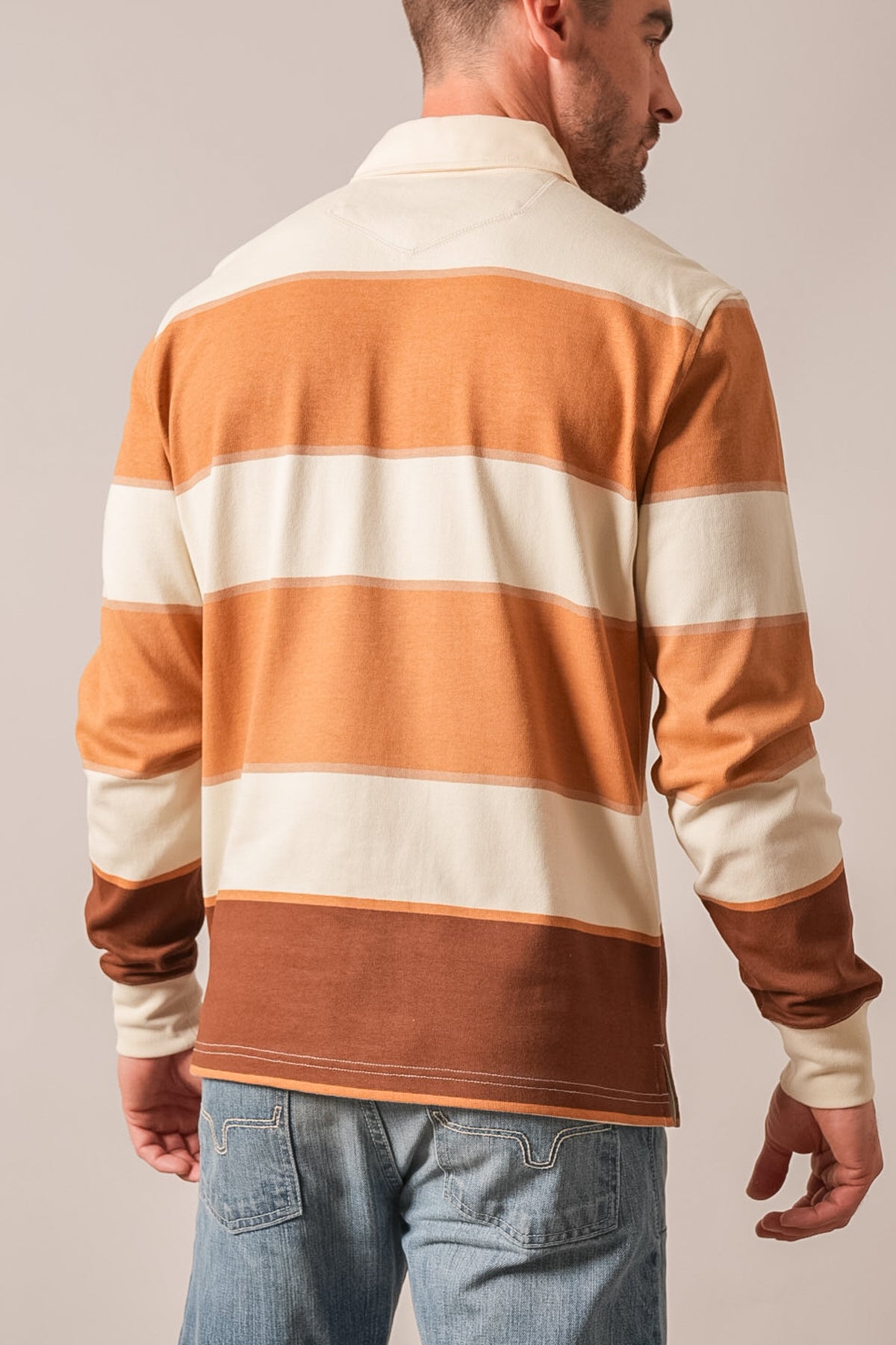 Kimes Ranch York polo shirt in Tan with wide horizontal stripes, back view, showing collar and long sleeves