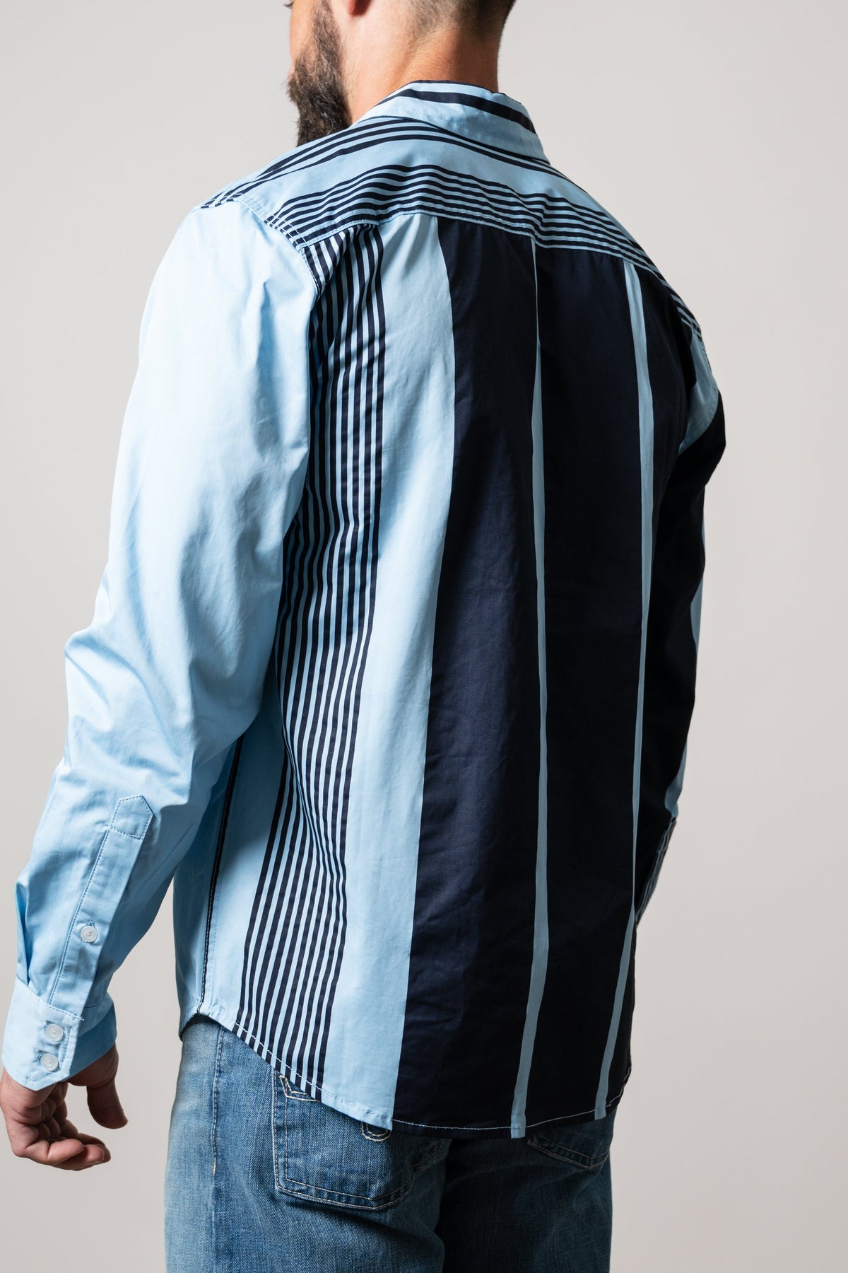 Kimes Ranch ZT 1 Arm Bandit dress shirt back view, light blue with navy yoke and striped panel