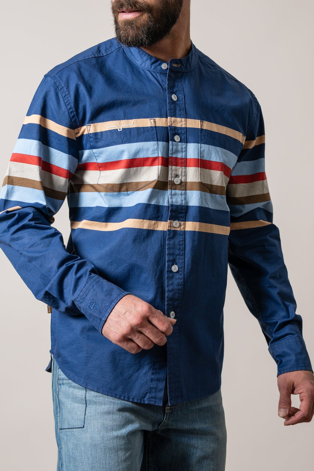 Kimes Ranch ZT Caliber dark blue long sleeve dress shirt with multi color horizontal stripes and two chest pockets