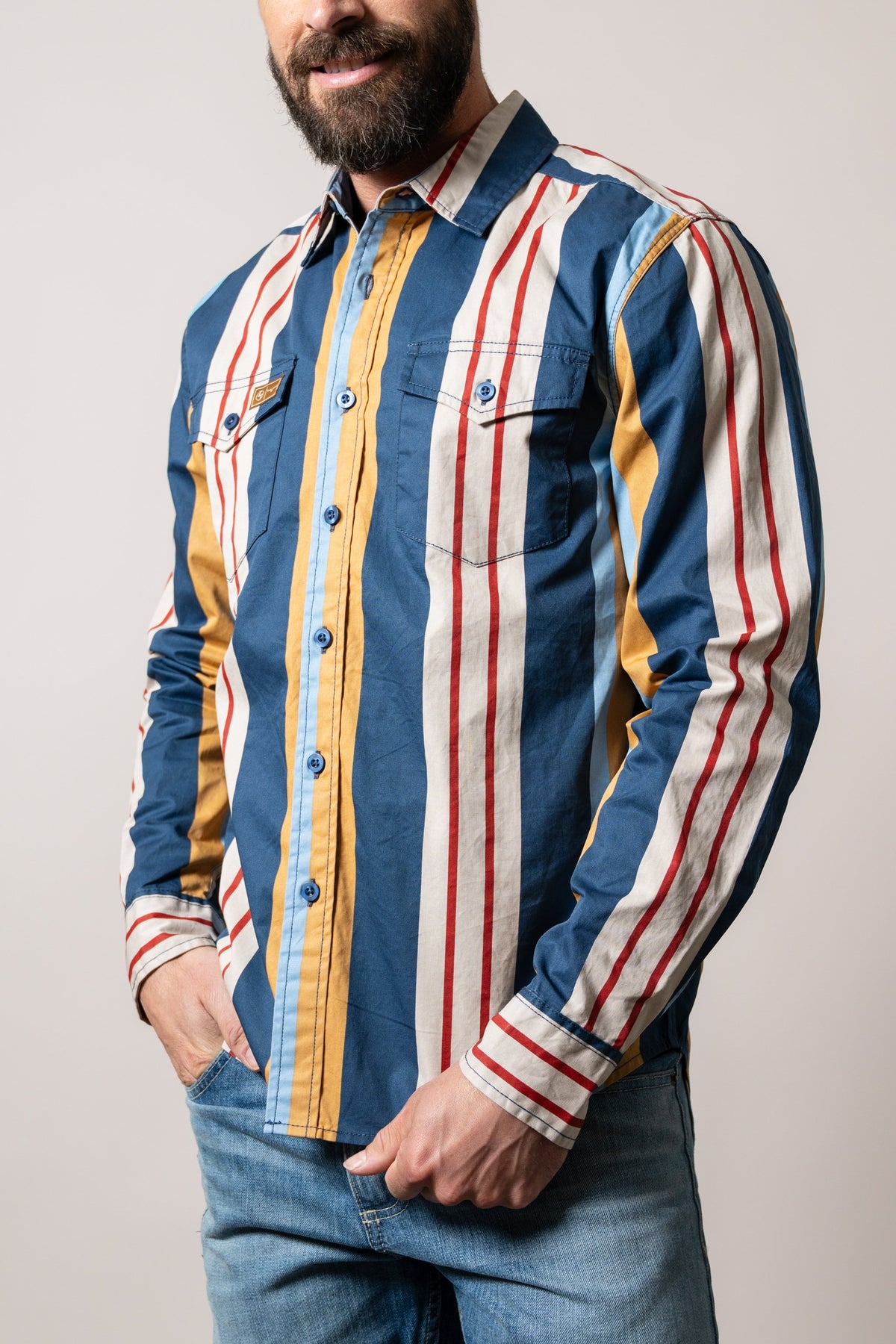 Kimes Ranch ZT Noxx long sleeve button-up dress shirt in dark blue with red and gold vertical stripes