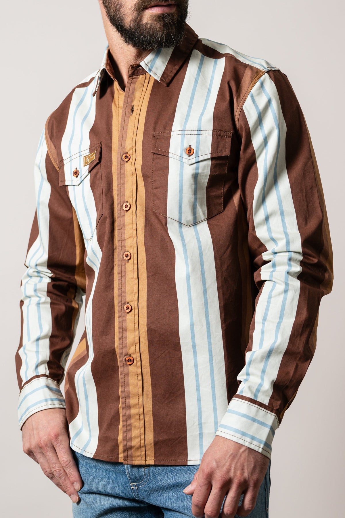 Kimes Ranch ZT Noxx dress shirt in Dark Brown with vertical stripes, two chest pockets with flaps, and a button-down collar