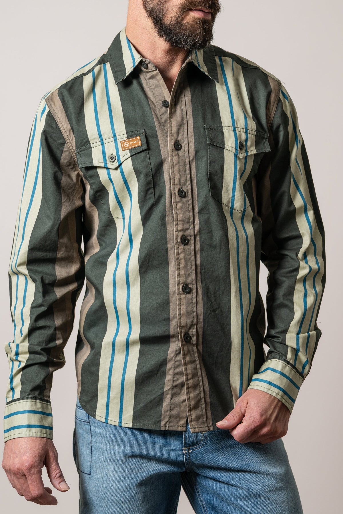Kimes Ranch ZT Noxx dress shirt in Forest with cream and blue stripes, two button flap chest pockets and logo patch