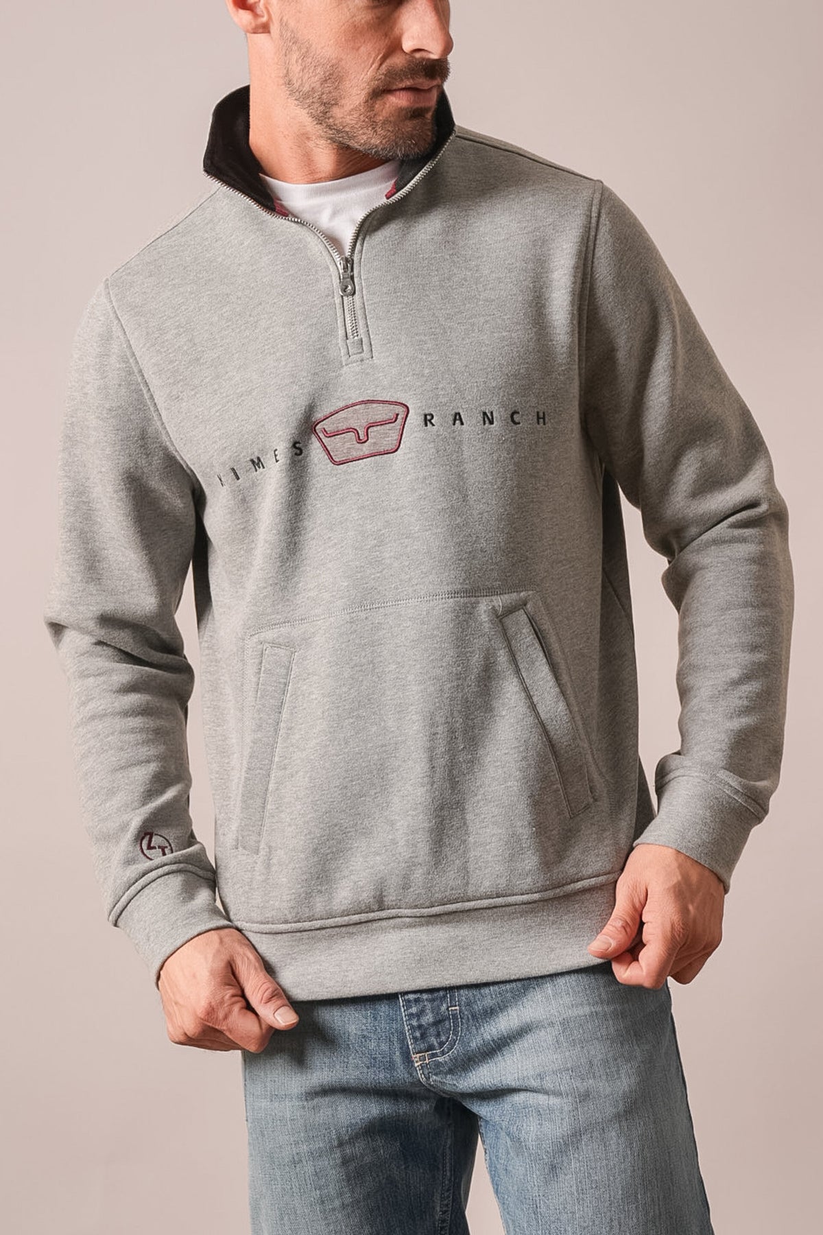 Kimes Ranch ZT Par Three sweatshirt in dark grey heather with quarter zip collar, kangaroo pockets, and logo