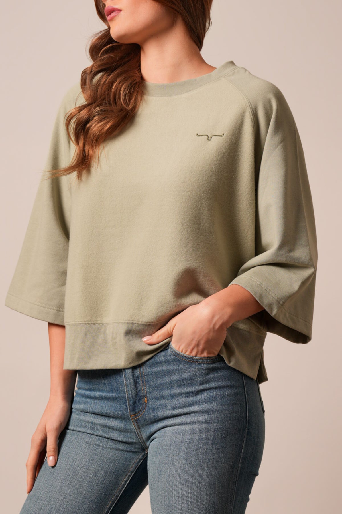 Kimes Ranch Addy sweatshirt in Sage, featuring a crew neck, dolman sleeves, and the Kimes Ranch logo embroidered on the front