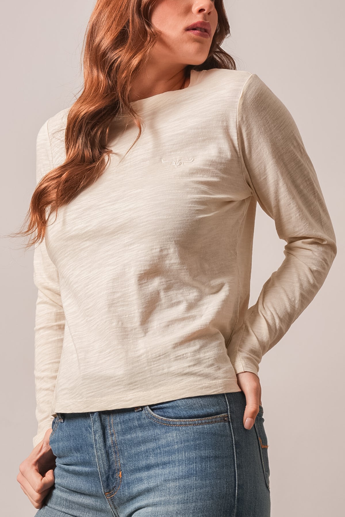 Kimes Ranch Ainsley top in Natural with long sleeves and a Kimes Ranch logo embroidered on the chest