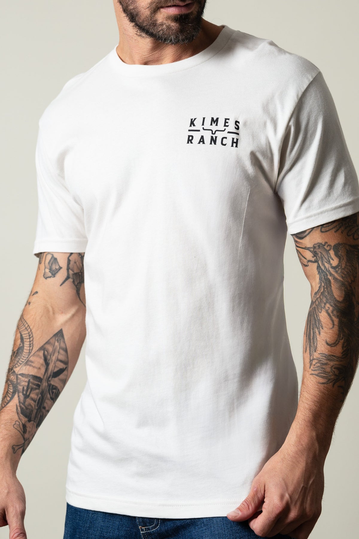 Kimes Ranch Back Branded short-sleeve crewneck t-shirt in bone with black Kimes Ranch logo on left chest; #color_bone