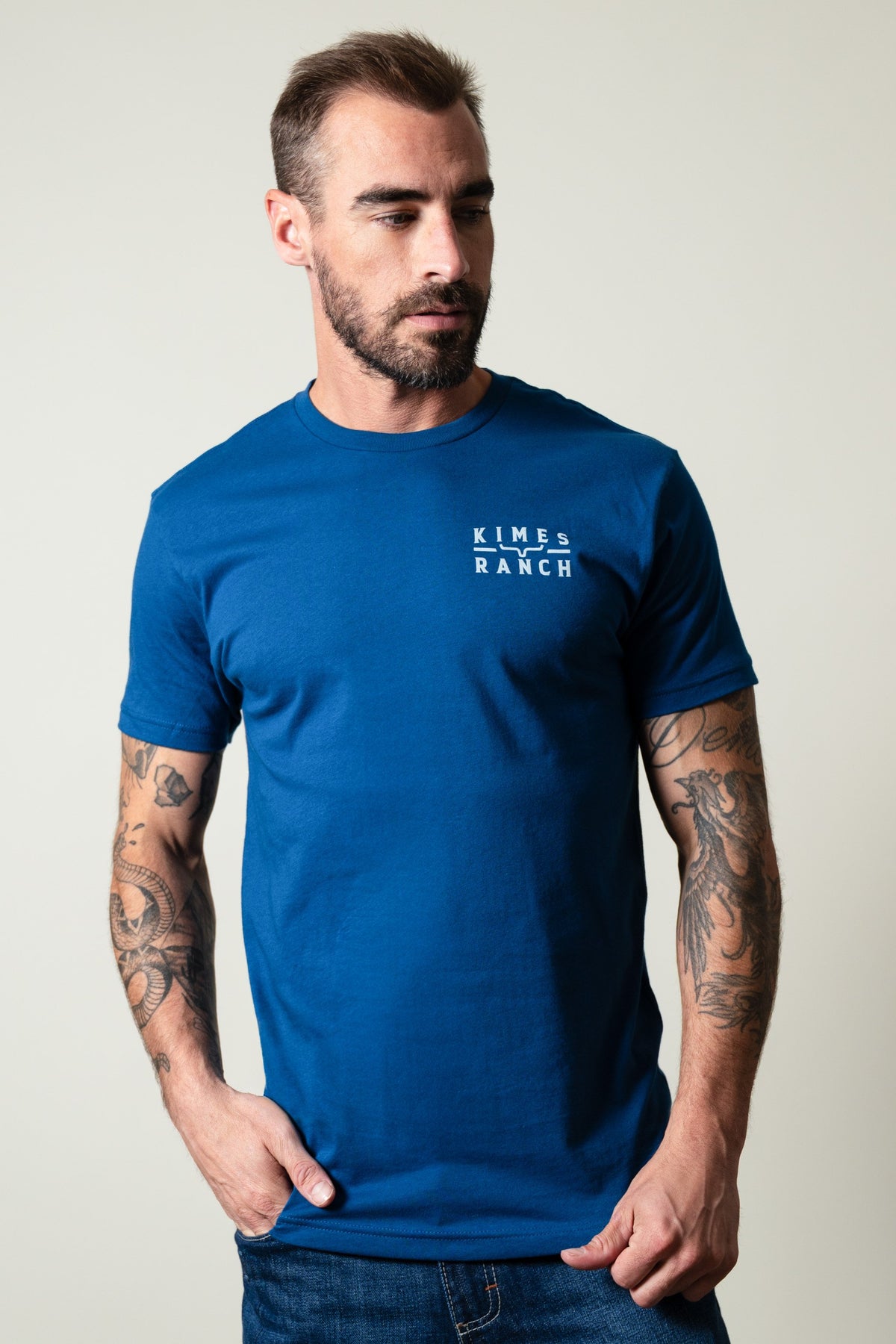 Kimes Ranch Back Branded shirt in Cool Blue with short sleeves, crew neck, and Kimes Ranch logo on chest; #color_cool blue