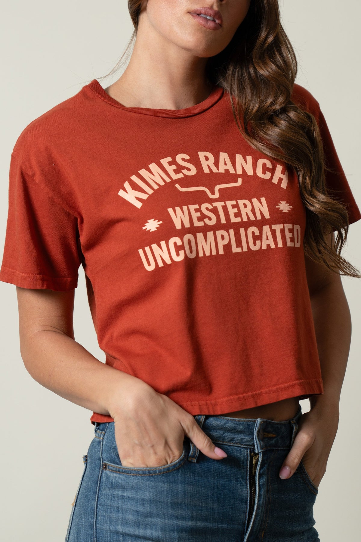 Kimes Ranch Cavell Burnt Red short sleeve tee featuring a vintage 'Kimes Ranch Western Uncomplicated' graphic print