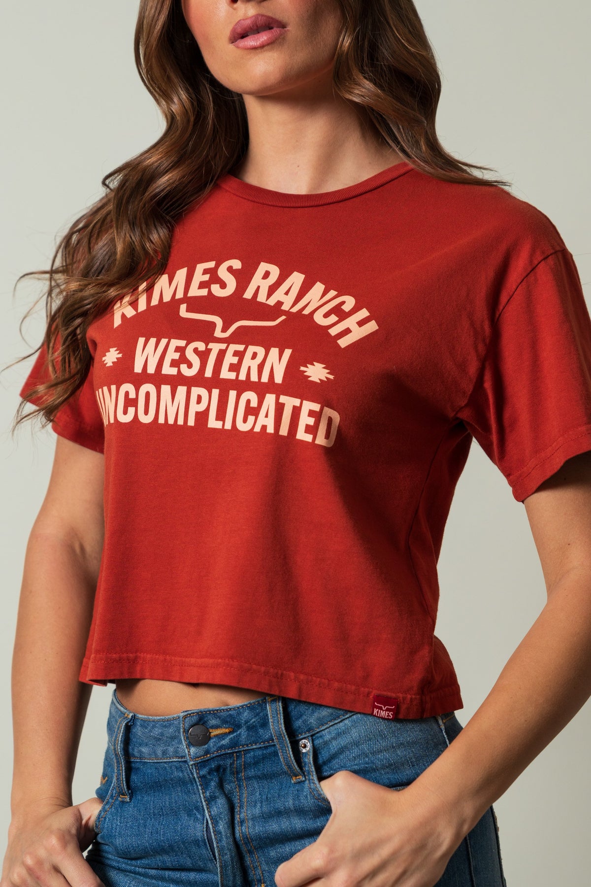 Kimes Ranch Cavell shirt, burnt red, with 'KIMES RANCH WESTERN UNCOMPLICATED' graphic in a cream color