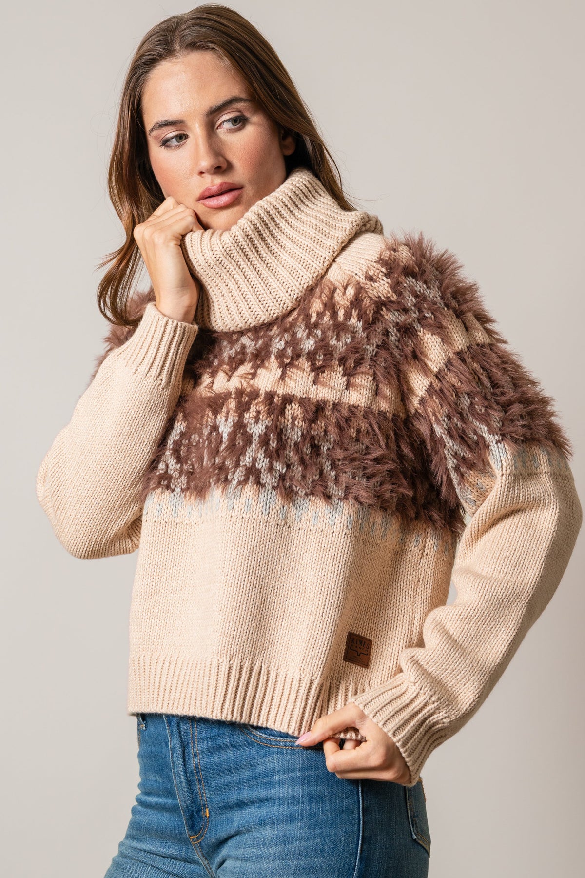 Kimes Ranch Corinne sweater with a beige knit body and a brown faux fur yoke featuring a fair isle pattern