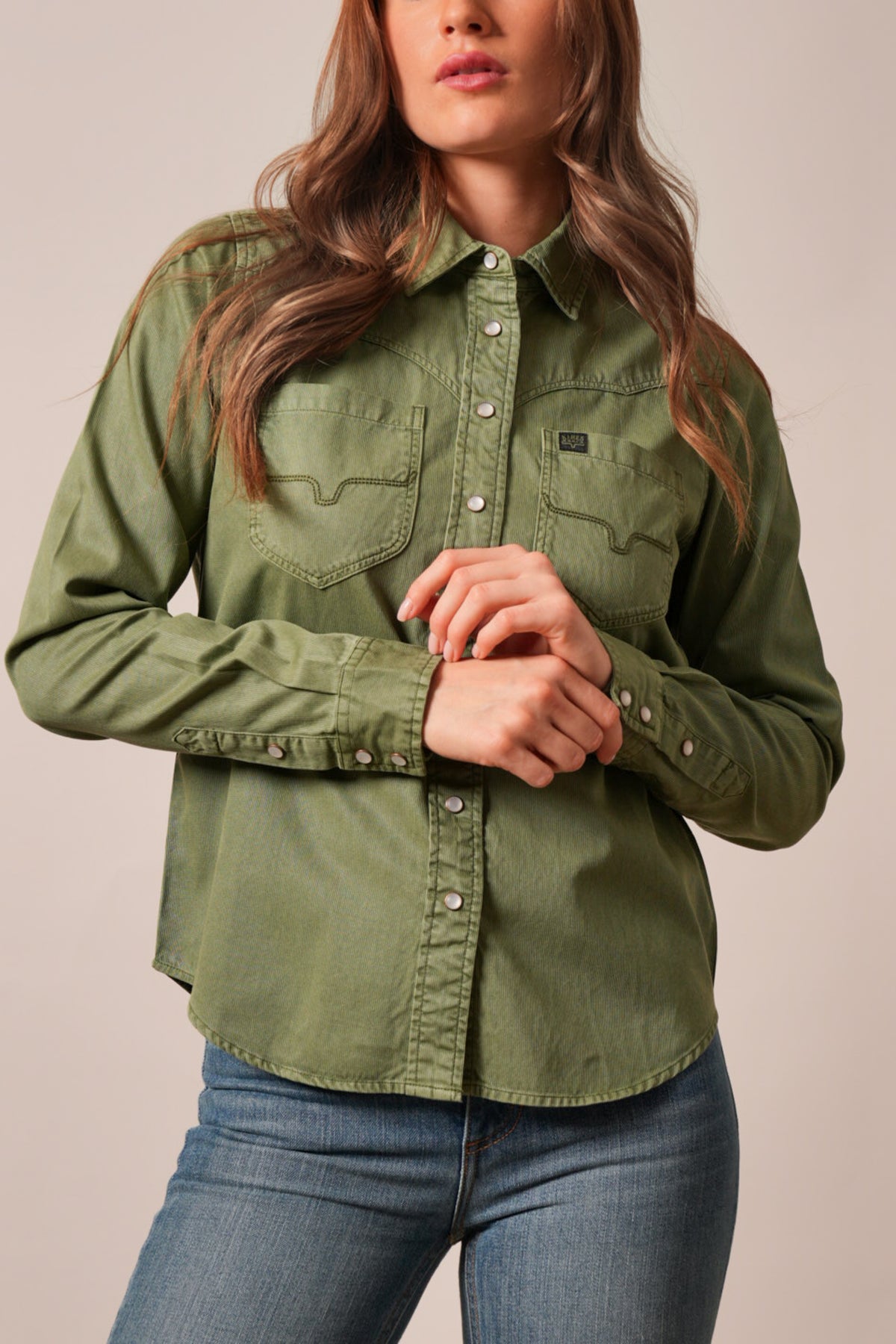 Kimes Ranch Della top in Moss, a long sleeve button-front shirt with western-stitch details on chest pockets and a Kimes