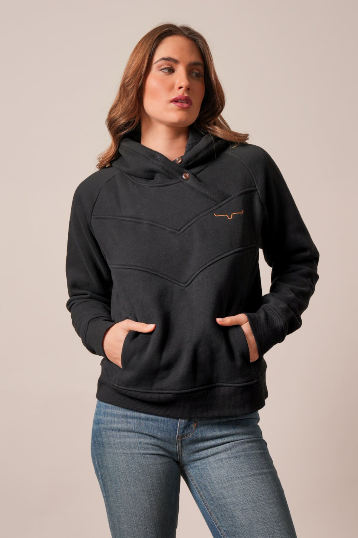 Kimes Ranch Ella black hoodie with long raglan sleeves, contoured yoke, snap placket, kangaroo pocket, and embroidered logo
