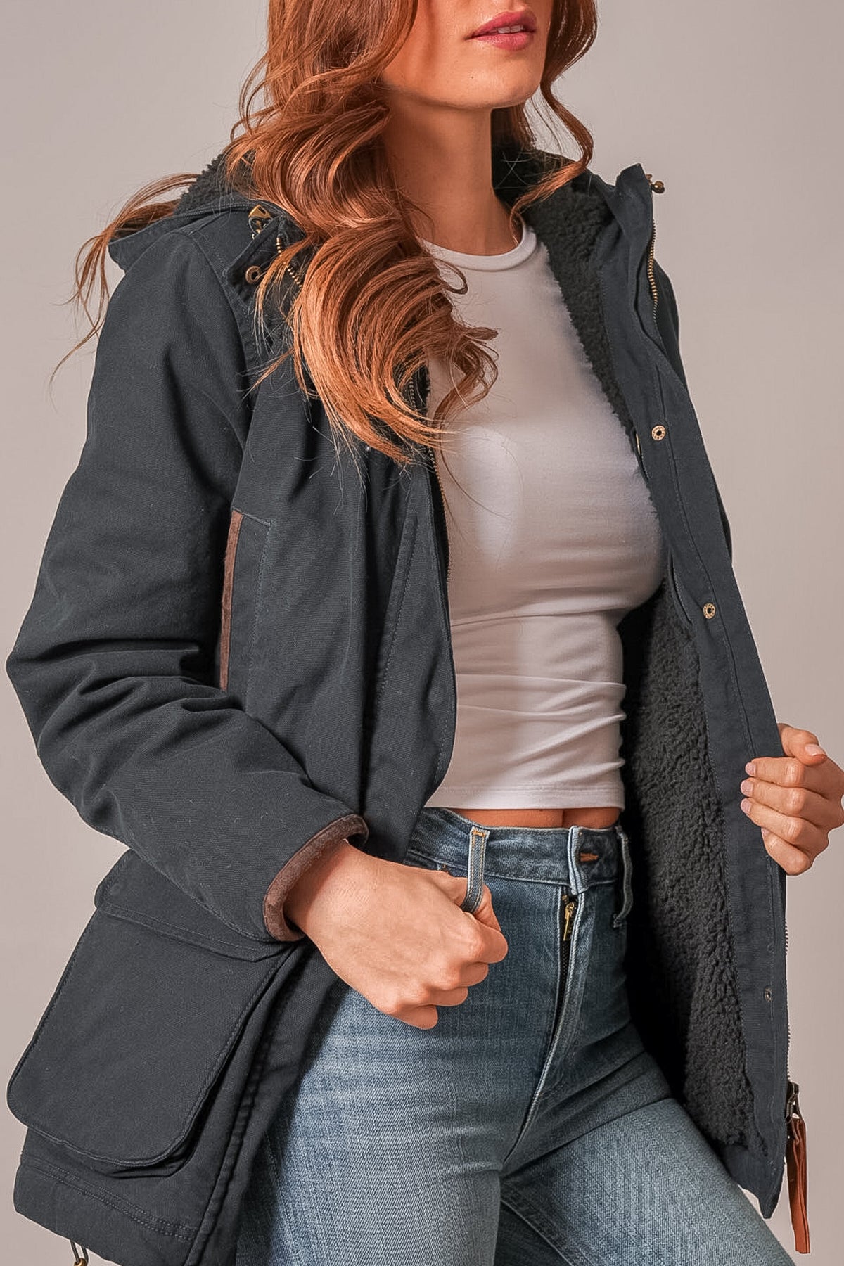 Kimes Ranch Emery black jacket with hood, front zip, flap pockets, and contrasting sherpa lining