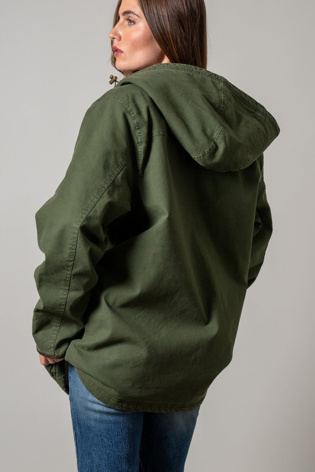 Kimes Ranch Emery jacket in Moss, back view showing an attached hood with wooden toggle drawstrings
