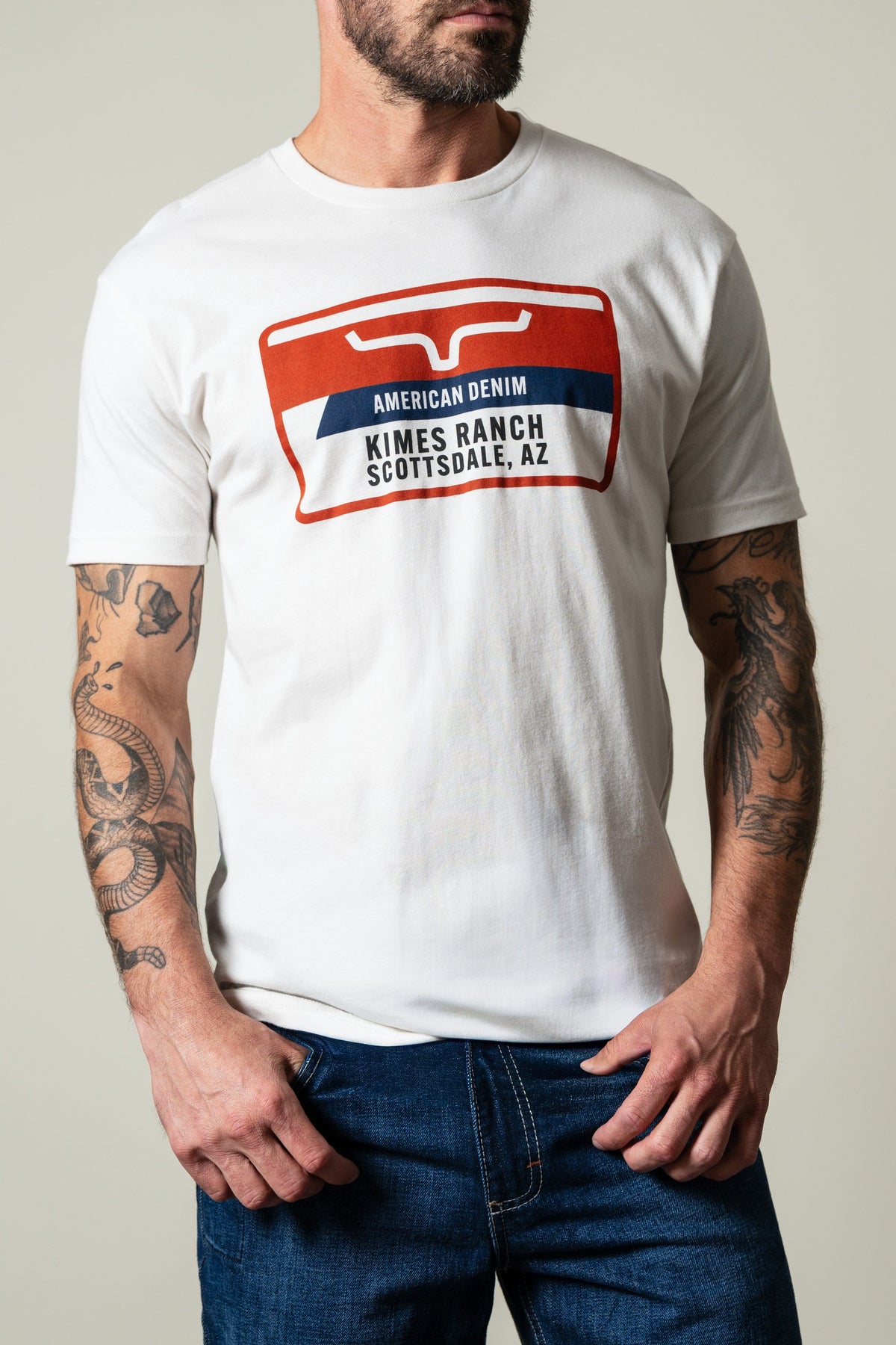 Kimes Ranch Feed Store t-shirt in white, short sleeve crewneck, graphic with red white blue Kimes Ranch Scottsdale AZ text; #color_bone
