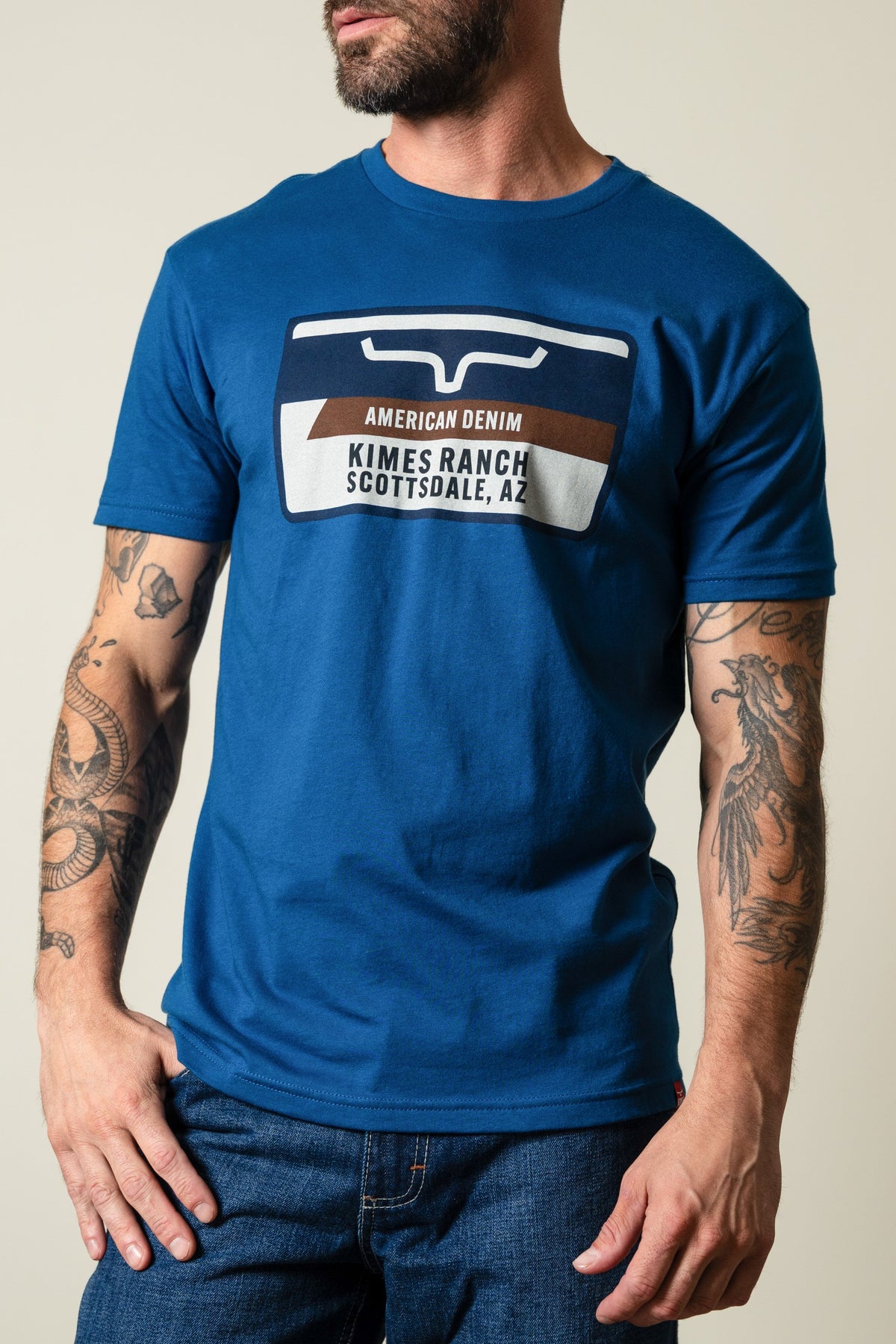 Men's Cool Blue Kimes Ranch Feed Store t-shirt with Kimes Ranch logo and "AMERICAN DENIM SCOTTSDALE, AZ" graphic; #color_cool blue
