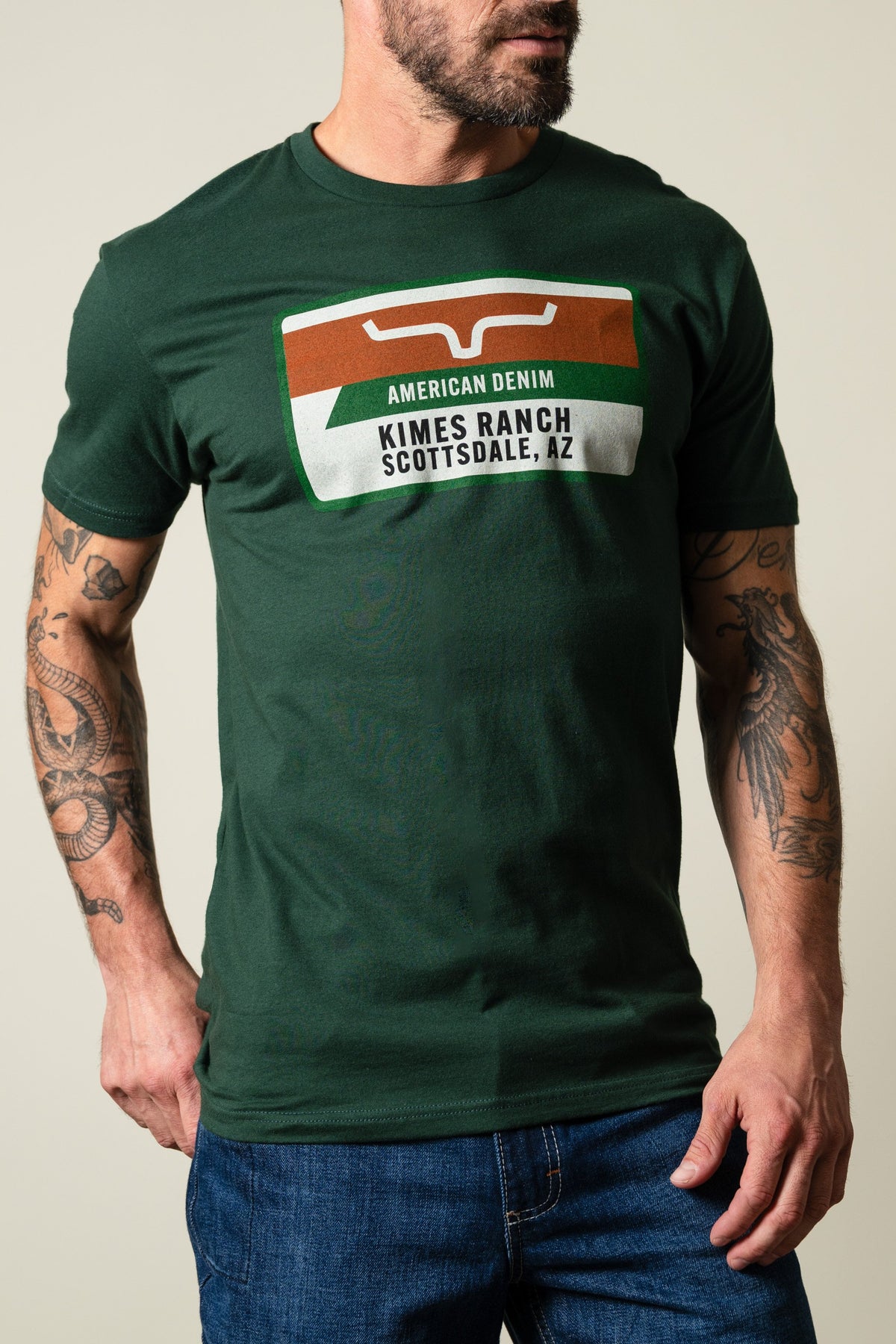 Kimes Ranch Feed Store t-shirt with rectangular graphic print featuring Kimes Ranch logo and text; #color_forest