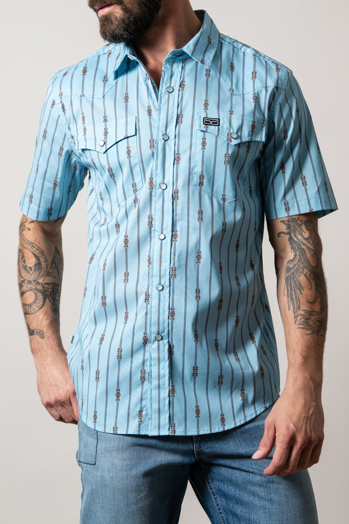 Kimes Ranch Gunner light blue short sleeve shirt with vertical stripe, two chest pockets, western yoke