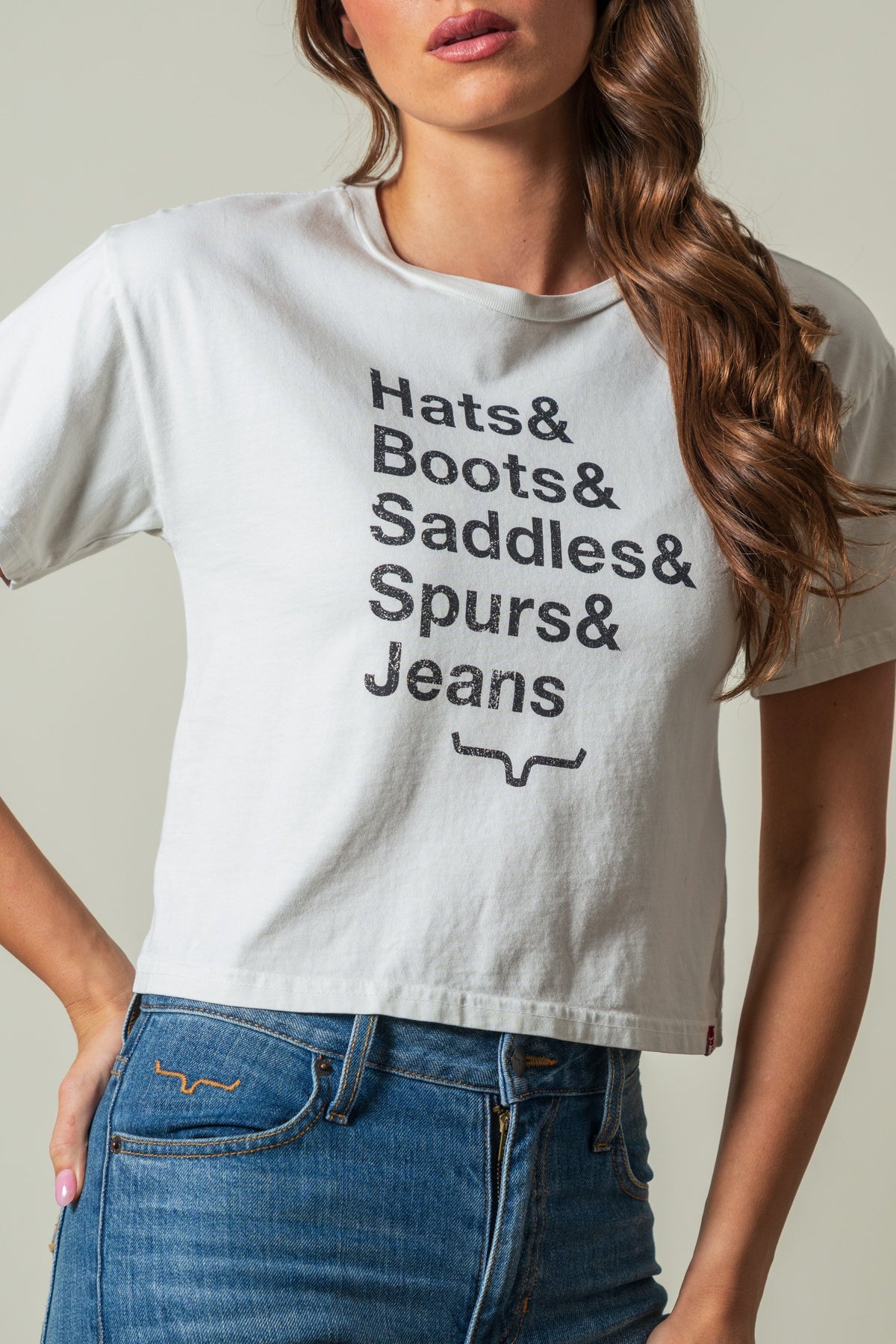 Kimes Ranch Hats & Boots t-shirt in Natural featuring text and stirrup graphic; #color_natural