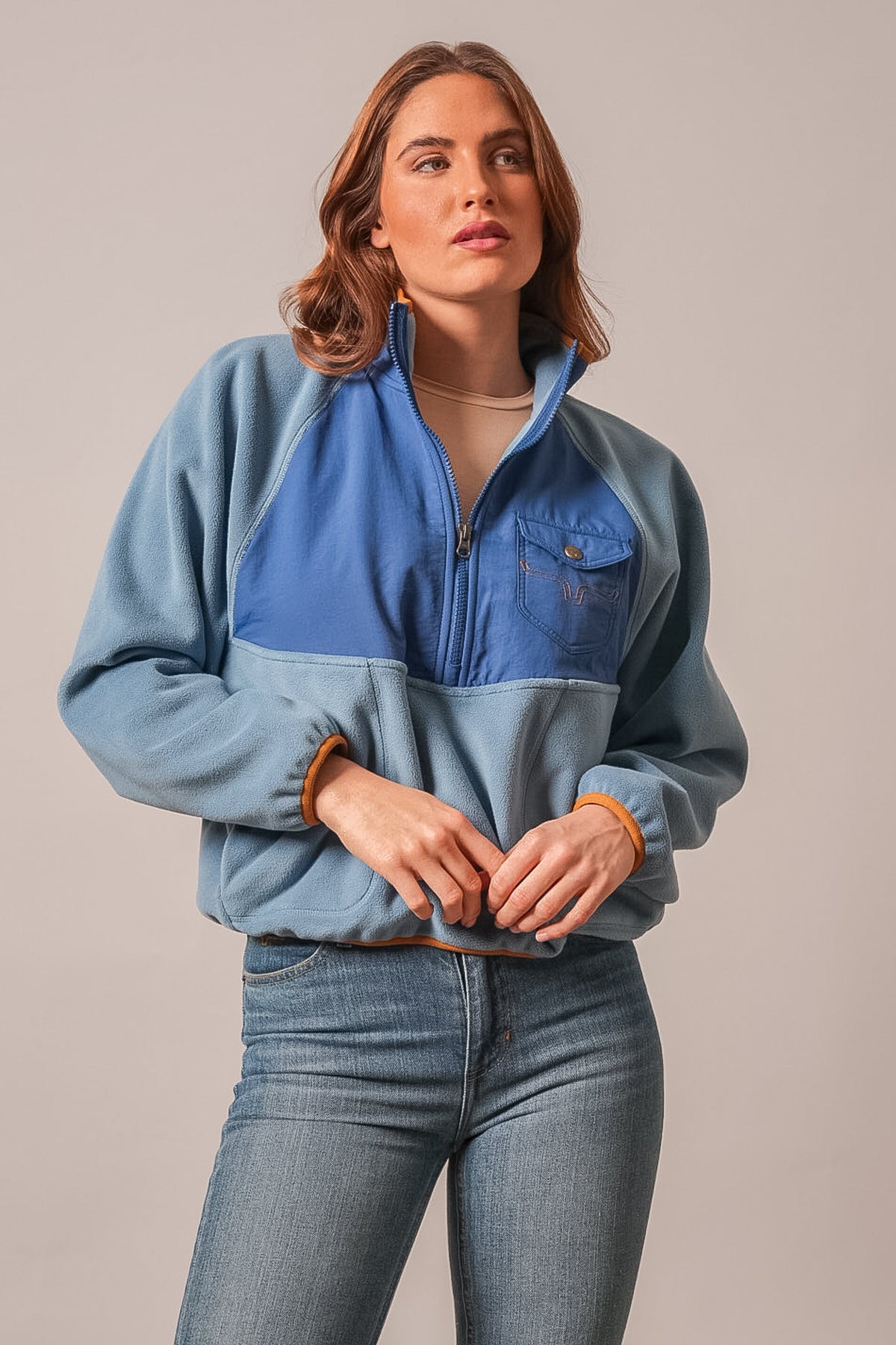 Kimes Ranch Indie sweatshirt in blue with darker blue colorblock panel, quarter zip, and long sleeves