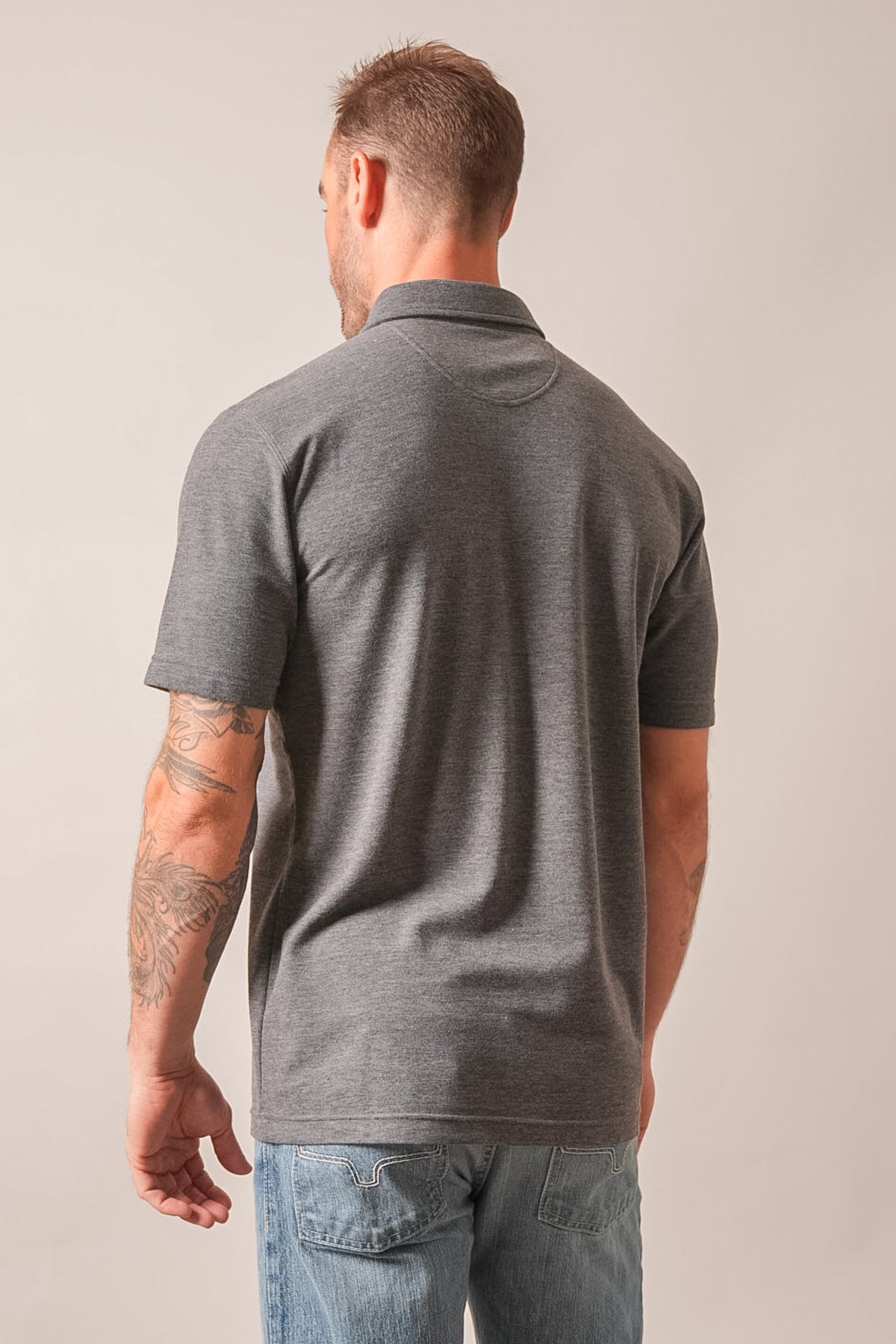Kimes Ranch Kingsley polo in charcoal heather, featuring a classic collar, short sleeves, and a tailored fit