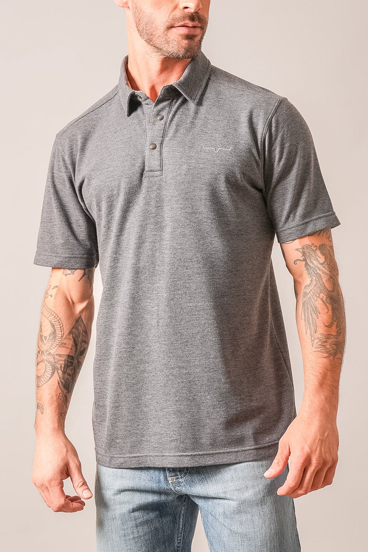Kimes Ranch Kingsley charcoal heather polo with short sleeves, ribbed collar, and Kimes Ranch logo on chest