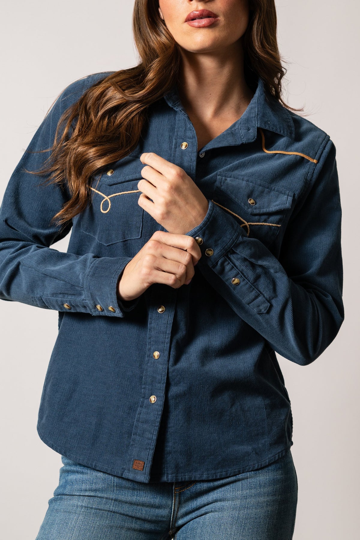 Kimes Ranch Lehi top in Dark Blue with long sleeves, snap buttons, chest pockets, and contrast topstitching