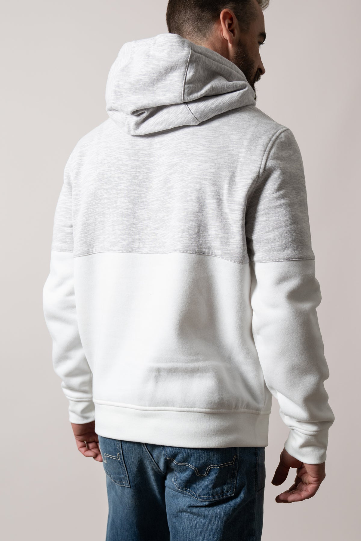 Kimes Ranch Mallard hoodie in natural showing back with heathered yoke and solid lower panel