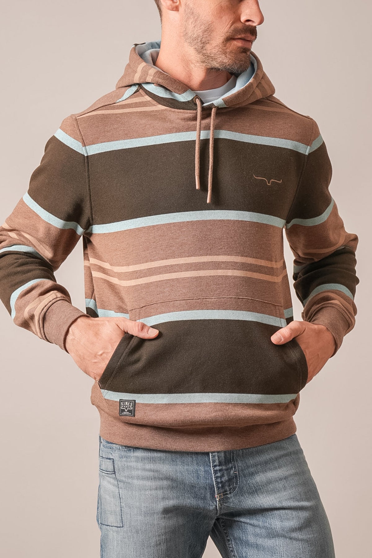 Kimes Ranch Owen hoodie in brown with horizontal stripes, kangaroo pocket, drawstring hood, and logo