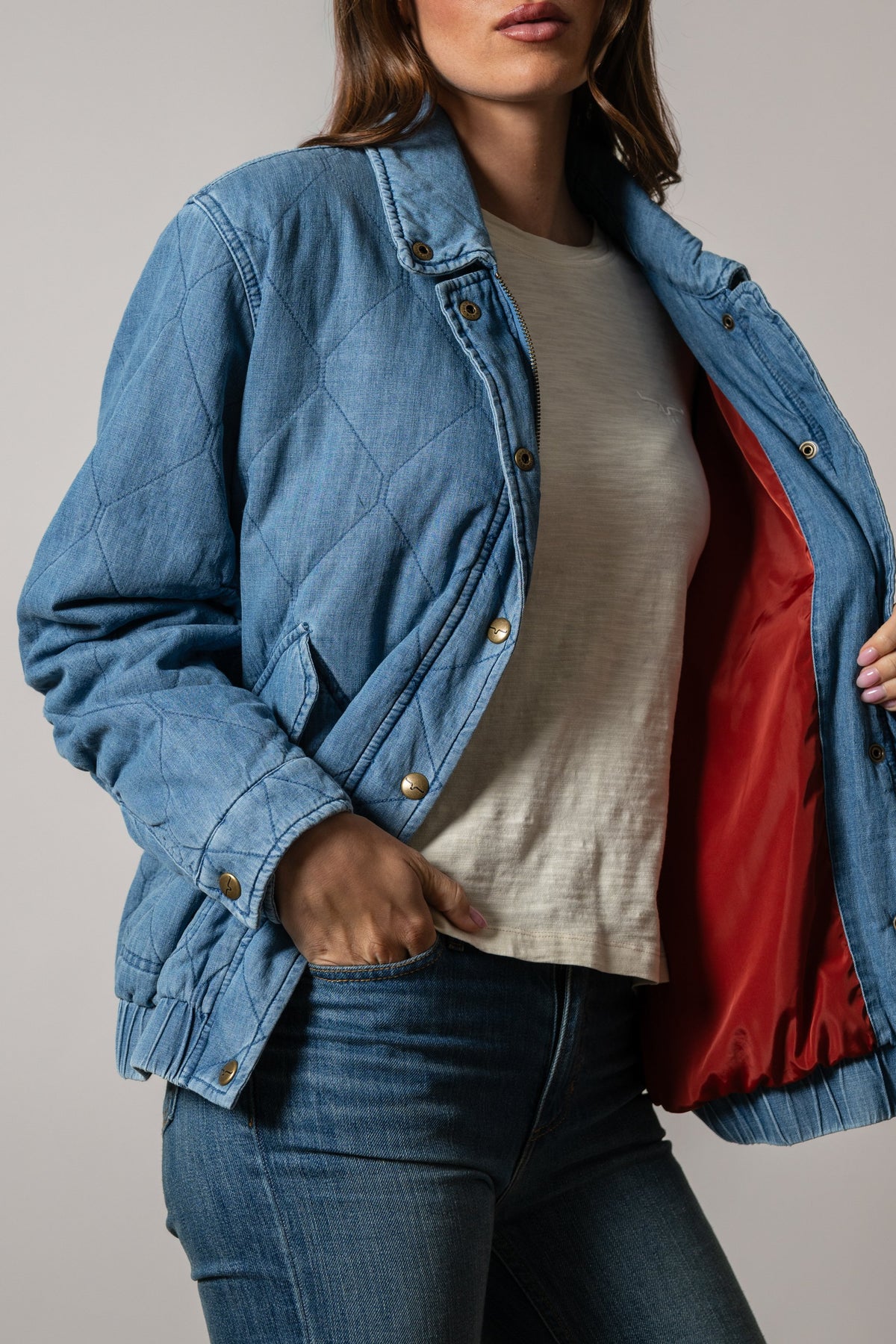 Kimes Ranch Phoeby indigo quilted bomber jacket with red satin lining and gold-tone snap closures