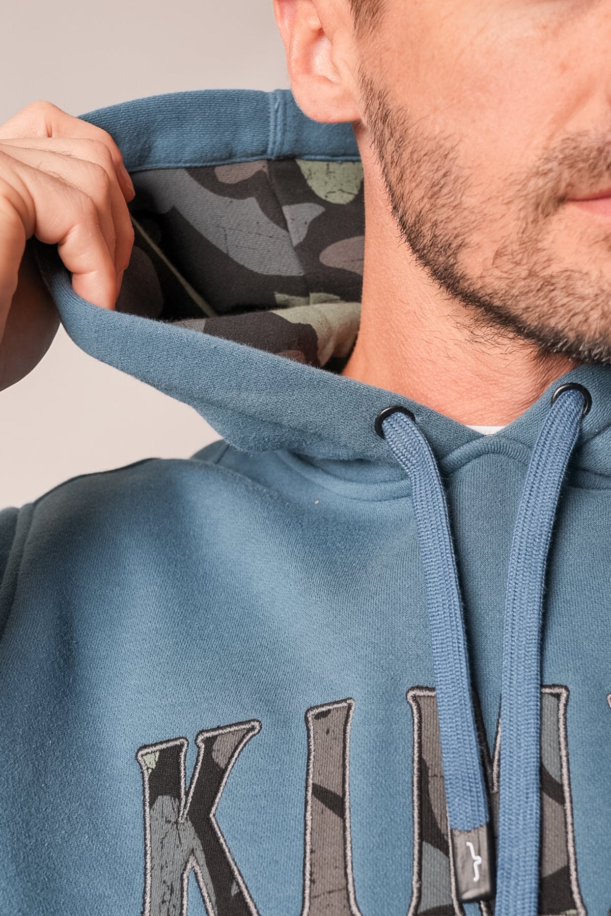 Kimes Ranch Riddle hoodie in Dark Blue with camouflage print lining inside the hood and matching camo graphic on the front