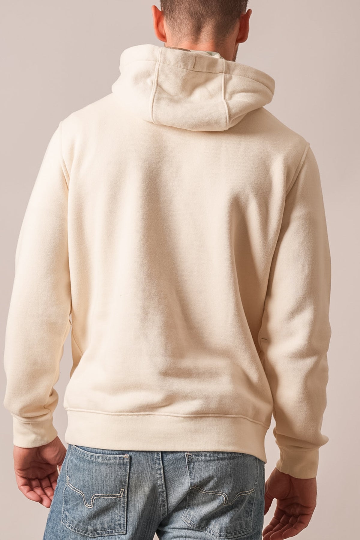 Kimes Ranch Riddle hoodie in natural showing back view with hood and ribbed hem
