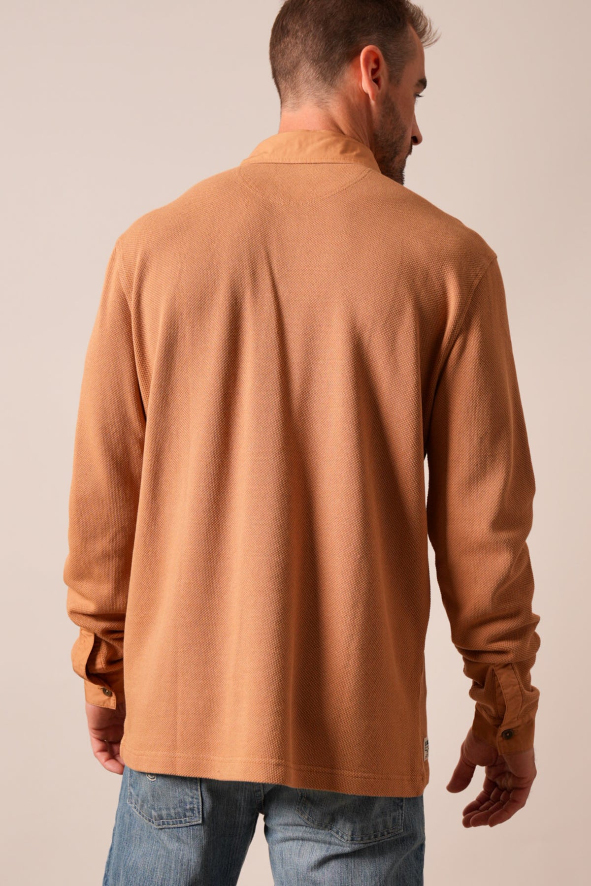 Kimes Ranch Rockaway polo shirt in Work Wear Brown, back view, long sleeves, waffle knit texture
